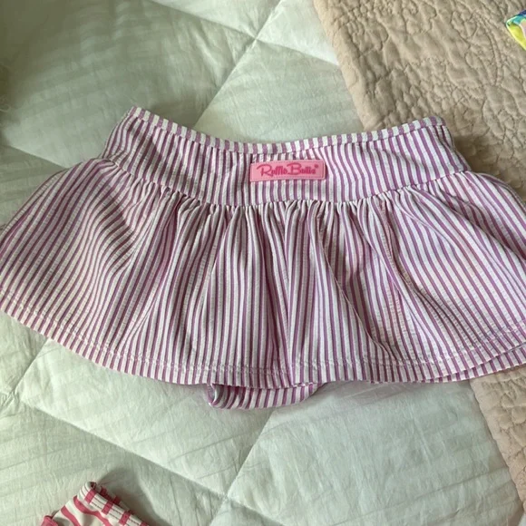 3 bikini bottoms and one bikini and swim shirt. These are all sold as a set - Picture 4 of 5